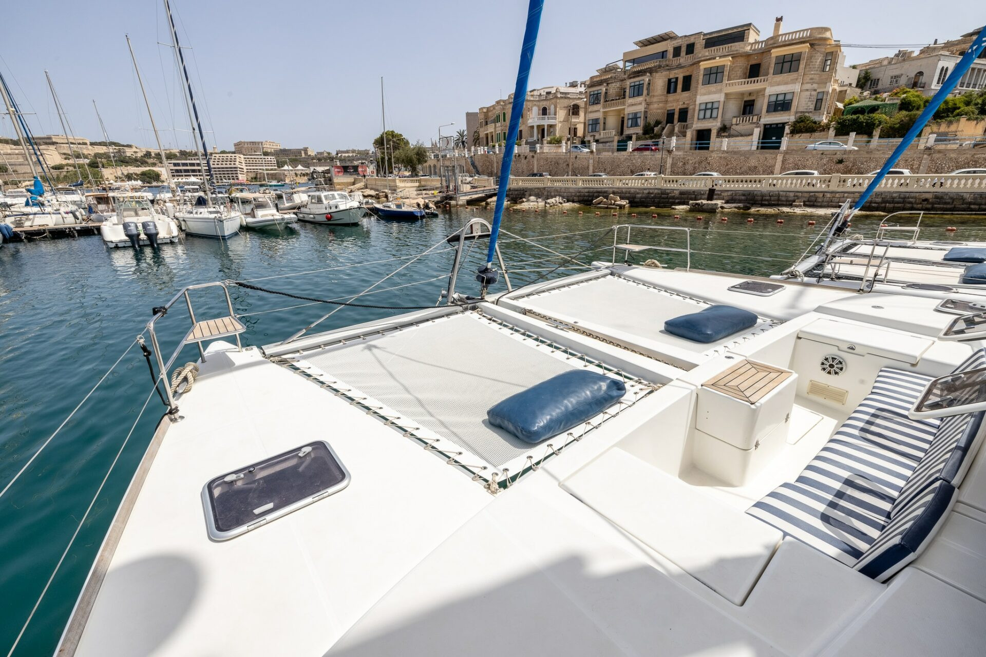 Bow deck of Pupa Mia catamaran moored in a Malta harbour