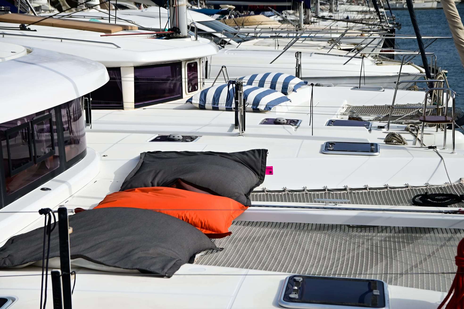 Bow cushions and trampoline netting aboard Bowie Lagoon 42 catamaran at the marina
