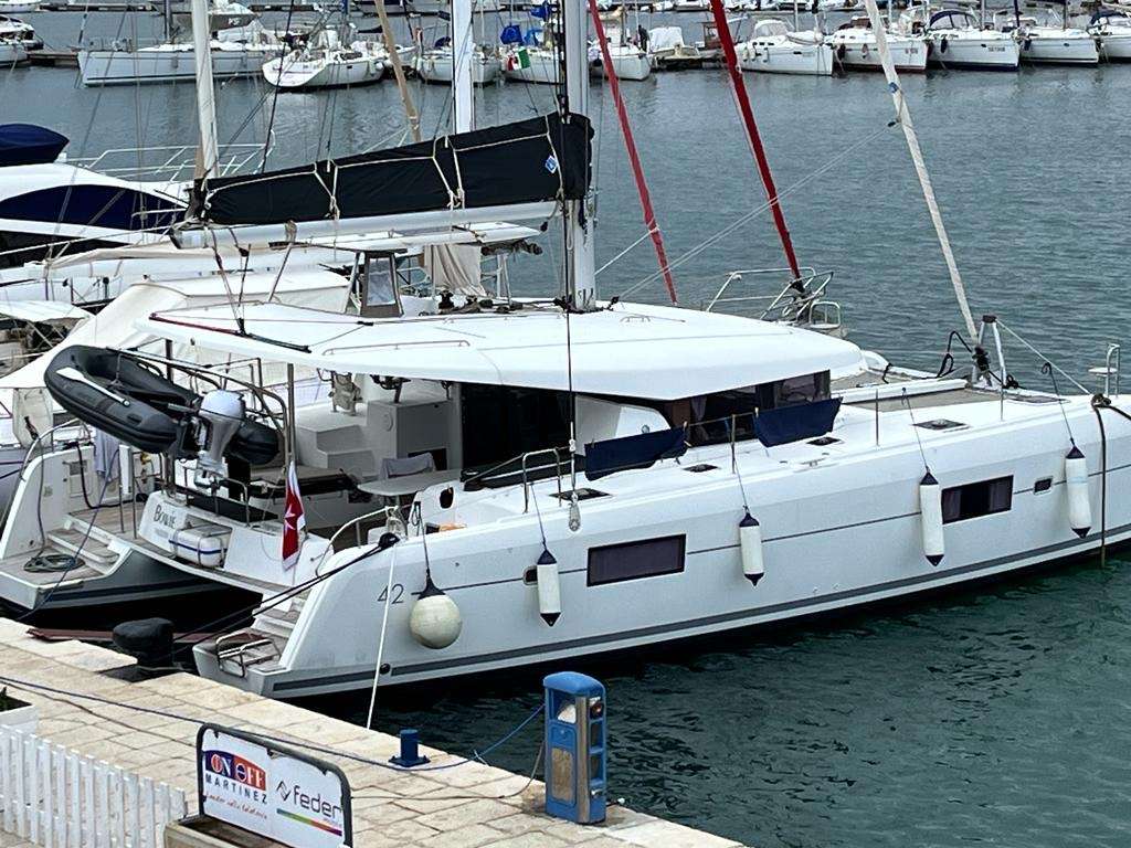 Bowie Lagoon 42 catamaran moored at a marina, name plate visible