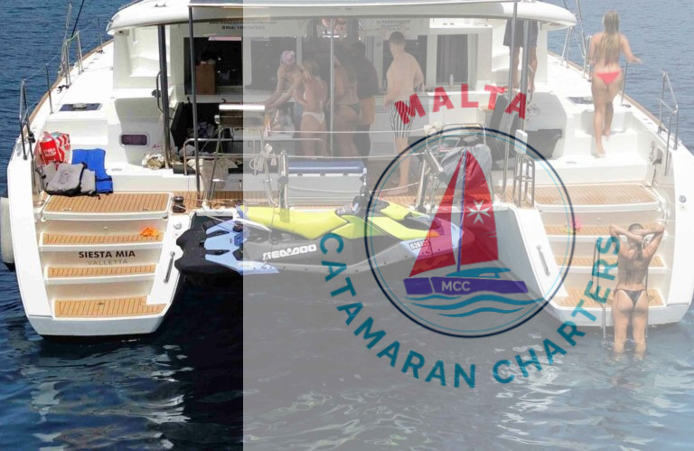 Rear view of Siesta Mia catamaran with a jet ski docked, name plate visible